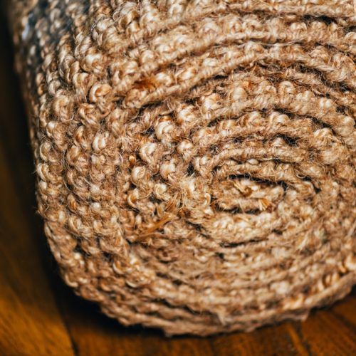 New,Rolled,Jute,Rug,With,Chunky,Texture,On,Oak,Flooring,